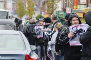 Republican Network for Unity (RNU) members display leaflets and stand in the road during a protest against District Police Partnership meetings being held in the Culturlann McAdam O'Fiaich on the Falls Road in Belfast | © Stephen Barnes, Demotix