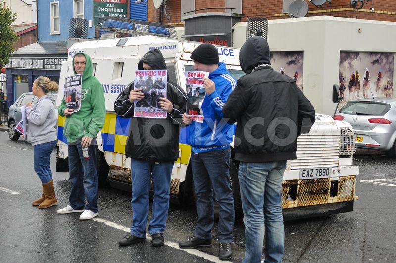 Republican Network for Unity (RNU) members display leaflets and stand in the road during a protest against District Police Partnership meetings being held in the Culturlann McAdam O'Fiaich on the Falls Road in Belfast | © Stephen Barnes, Demotix